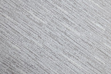 Stylish grey wallpaper as background, closeup view