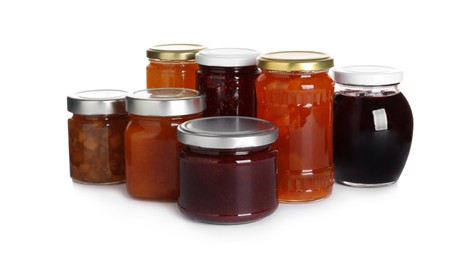 Photo of Jars with different jams on white background