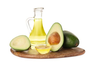 Photo of Cooking oil and fresh avocados isolated on white