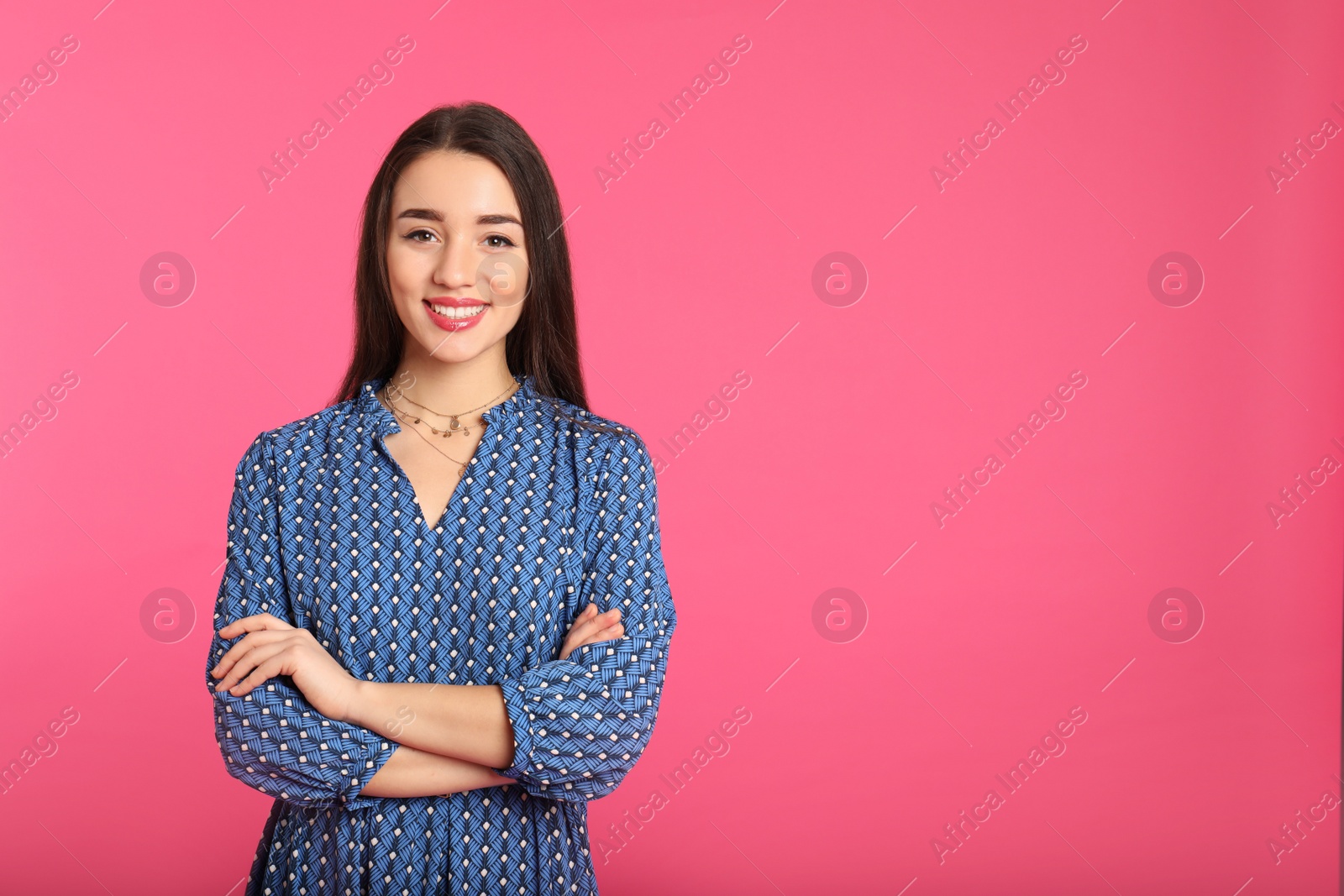 Photo of Portrait of beautiful young woman in stylish dress on color background. Space for text