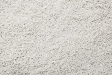 Raw basmati rice as background, top view