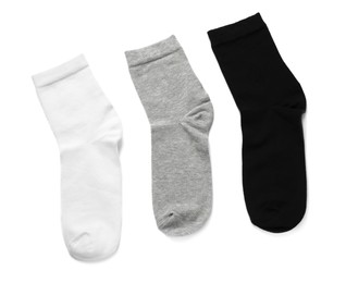 Photo of Different socks isolated on white, top view