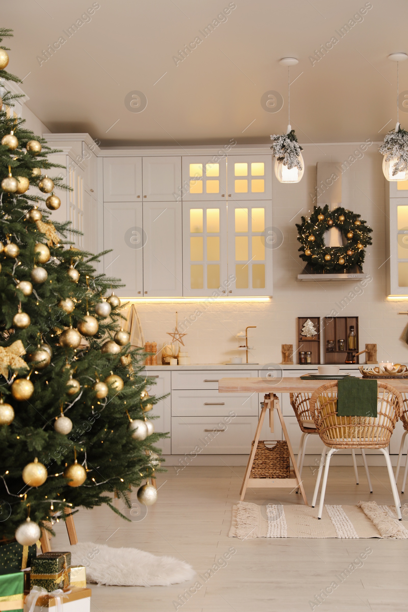 Photo of Cozy spacious kitchen decorated for Christmas. Interior design