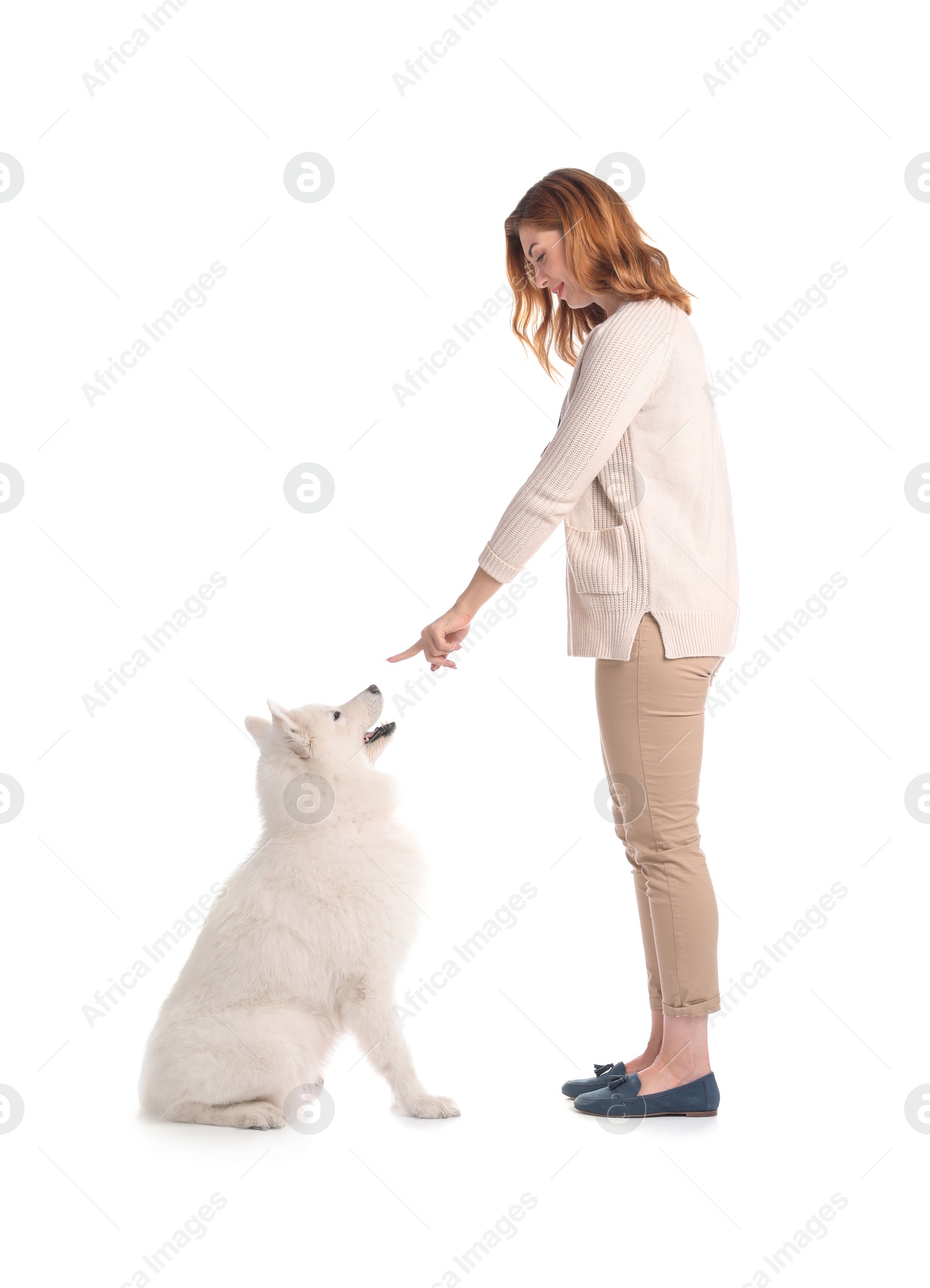 Photo of Beautiful woman with her cute dog on white background