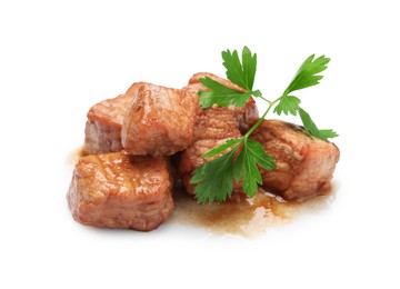 Pieces of delicious cooked beef and parsley isolated on white. Tasty goulash