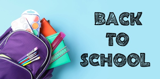 Image of Text Back To School and backpack with different stationery on light blue background, top view. Banner design 