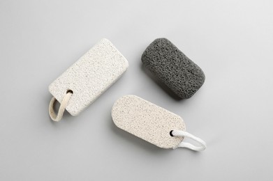 Photo of Pumice stones on light background, flat lay