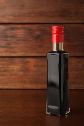 Photo of Bottlesoy sauce on wooden table