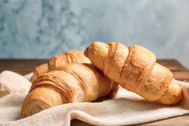 Tasty croissants on table, closeup