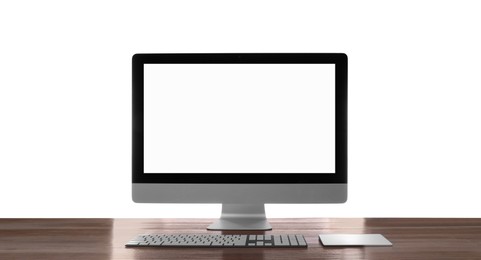 Photo of Modern computer with blank monitor screen and peripherals on wooden table against white background