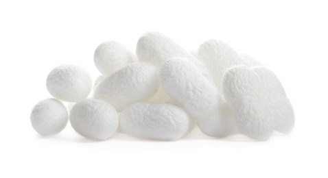 Photo of Pile of natural silkworm cocoons on white background