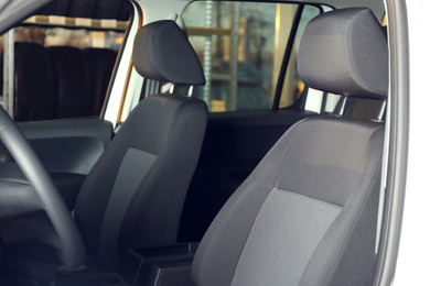 Photo of Modern car interior with comfortable grey seats