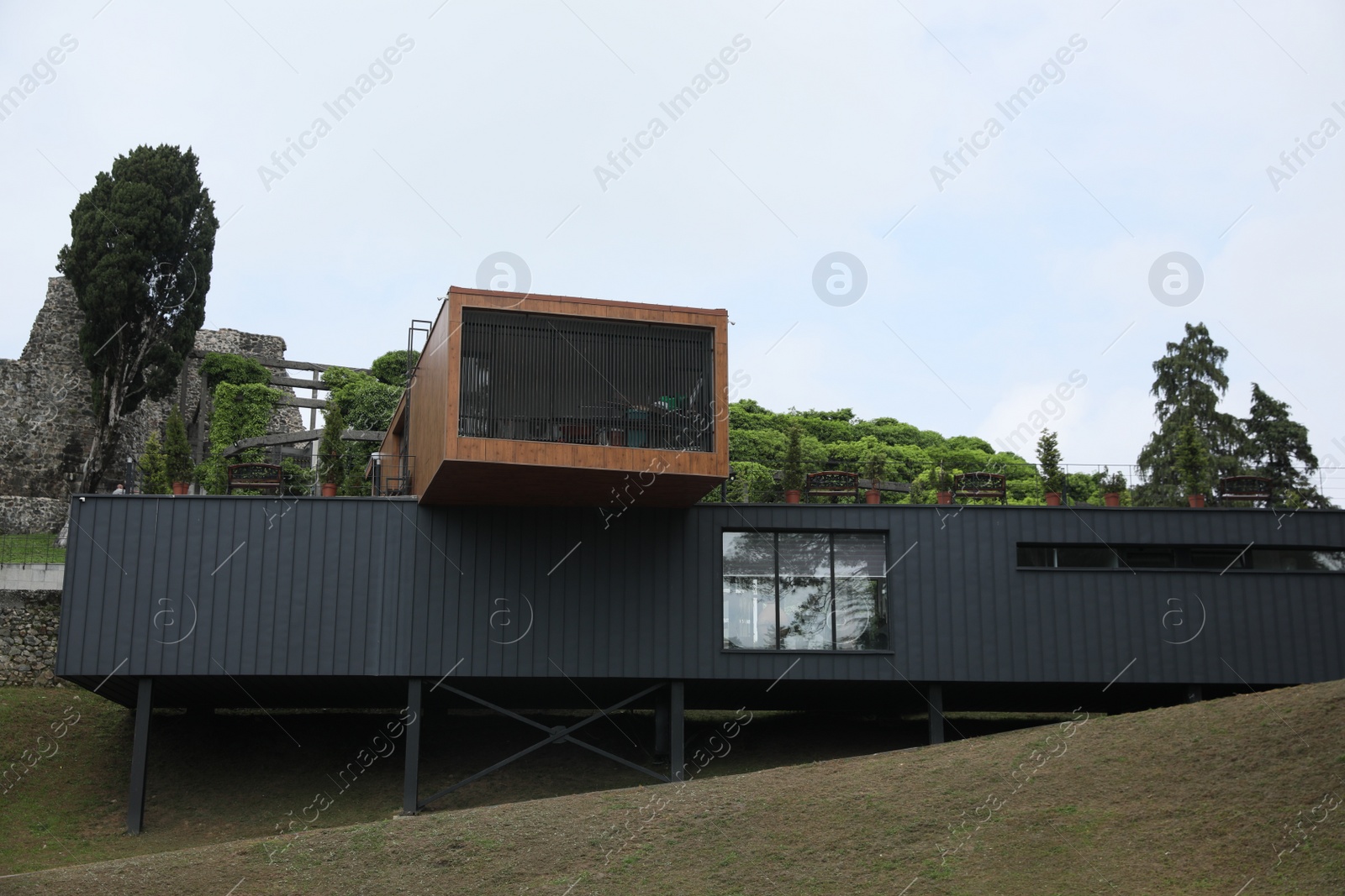 Photo of Georgia, Tsikhisdziri - July 07, 2022: Modern building of touristic center near Petra fortress