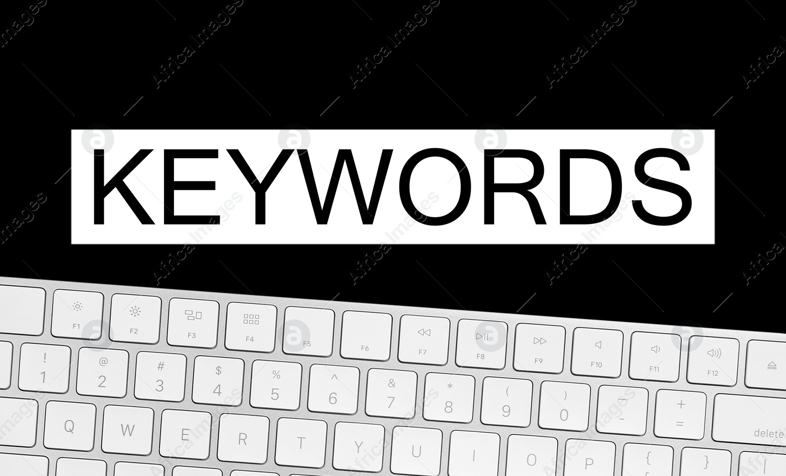 Image of Word Keywords and computer keyboard on black background. SEO direction