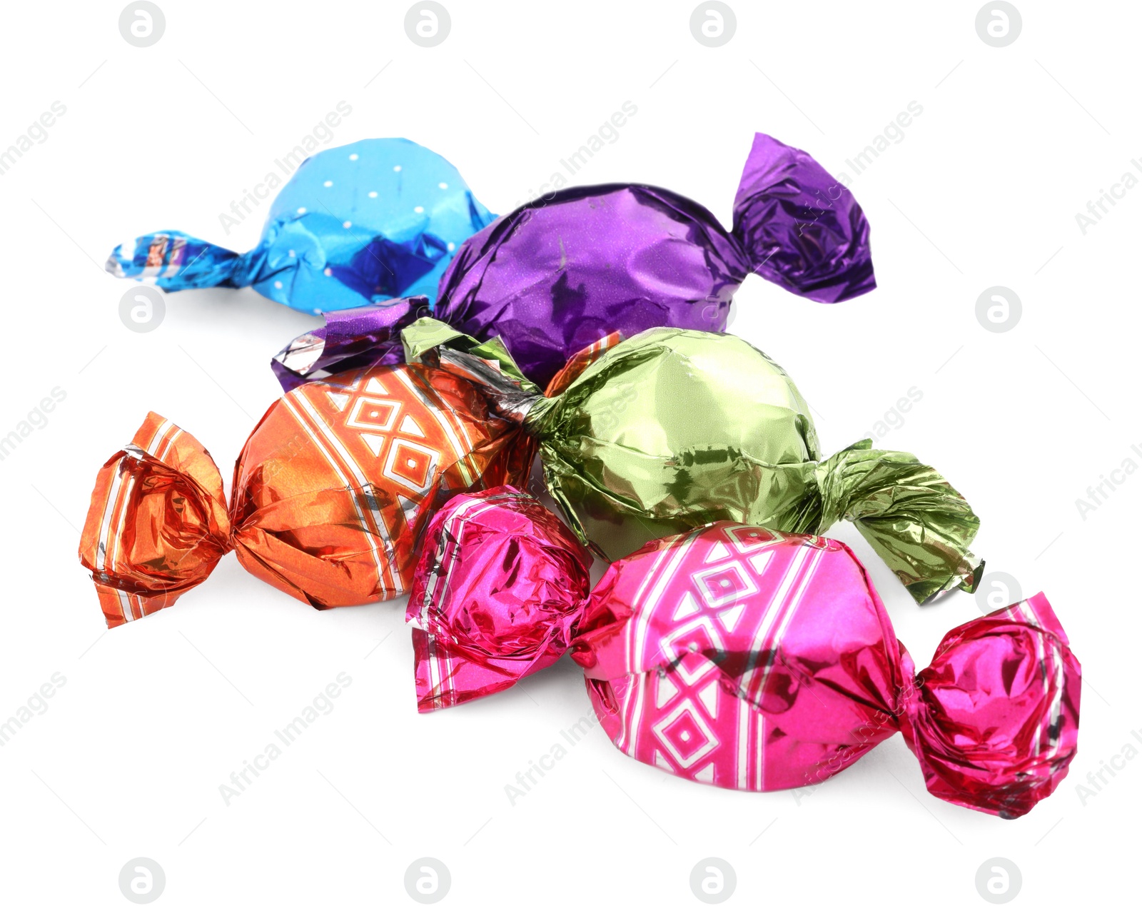 Photo of Sweet candies in colorful wrappers on white background