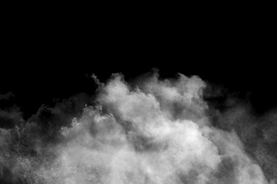 Image of Cloud of white smoke on black background