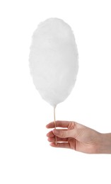 Photo of Woman holding sweet cotton candy on white background, closeup