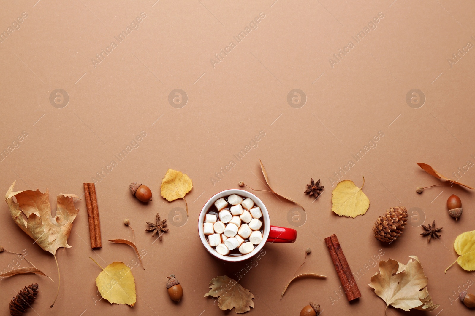 Photo of Flat lay composition with hot drink on beige background, space for text. Cozy autumn