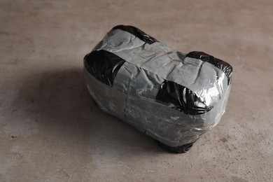 Package with narcotics on grey textured table