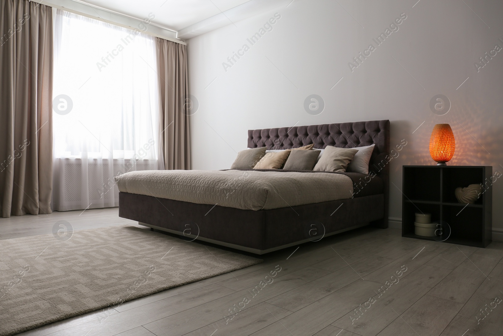 Photo of Contemporary room interior with comfortable double bed