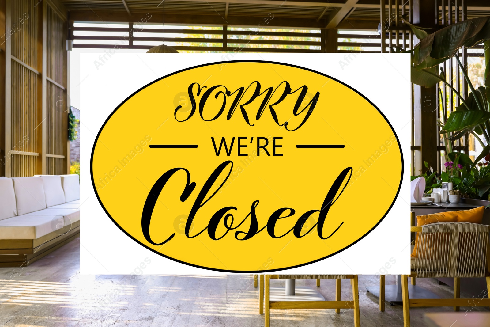 Image of Sorry we are closed sign. Cozy cafe with stylish furniture