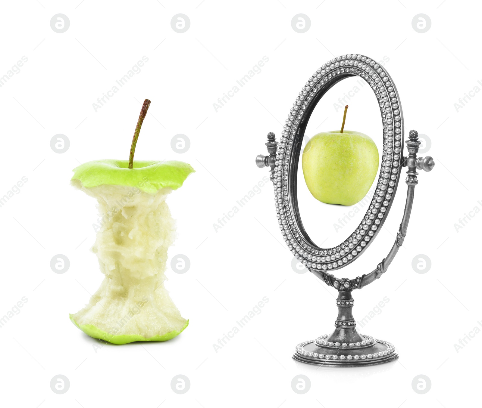 Image of Apple core and mirror with reflection on white background