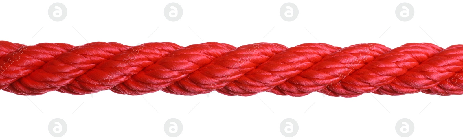 Photo of Strong red climbing rope on white background