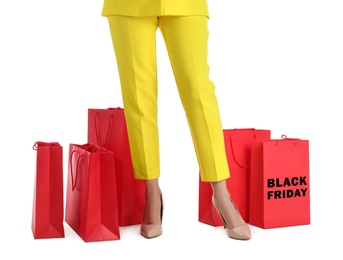 Photo of Woman and shopping bags on white background, closeup. Black Friday Sale