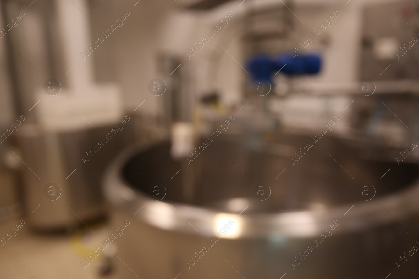 Photo of Blurred view of curd preparation tank at cheese factory