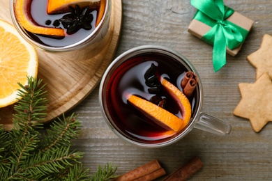 Flat lay composition with aromatic mulled wine on wooden table