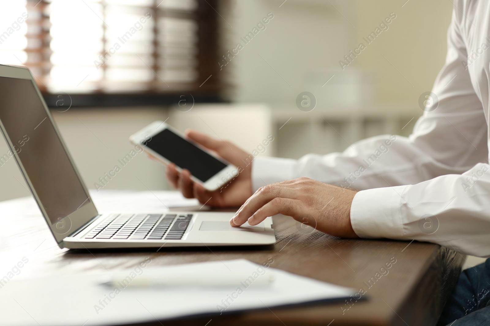 Photo of Business trainer working at table in office, closeup