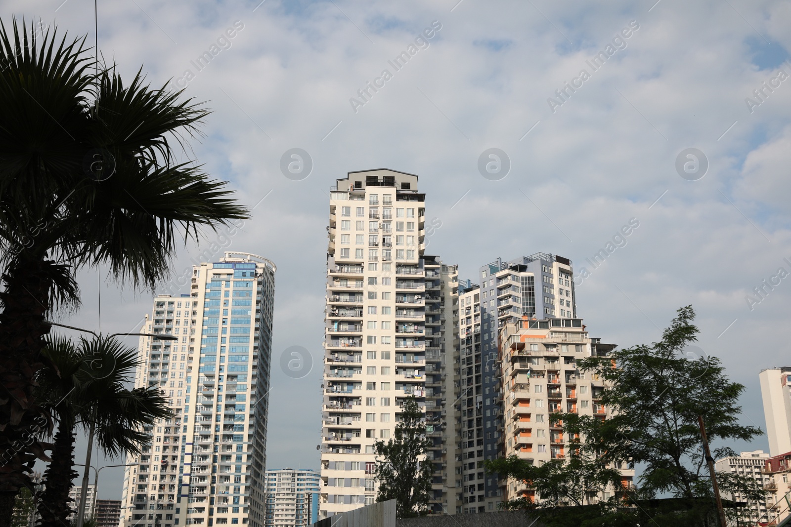 Photo of Georgia, Batumi - July 07, 2022: Modern multistory buildings under cloudy sky