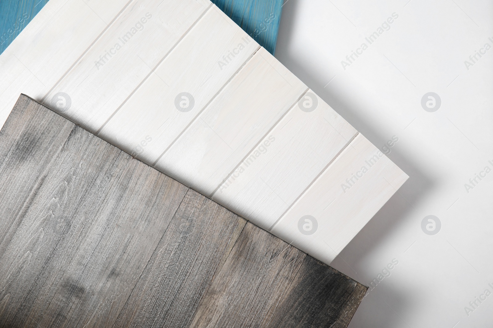 Photo of Different wooden surfaces for photography on white background, top view