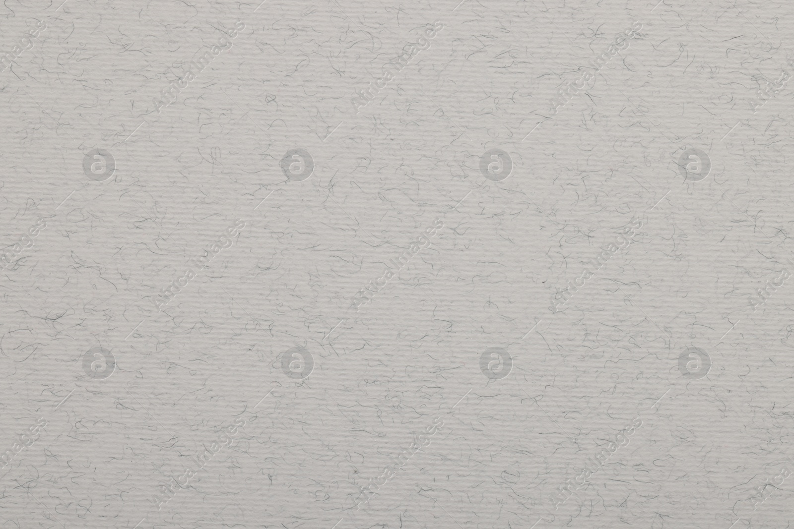 Photo of Texture of light grey paper sheet as background, top view