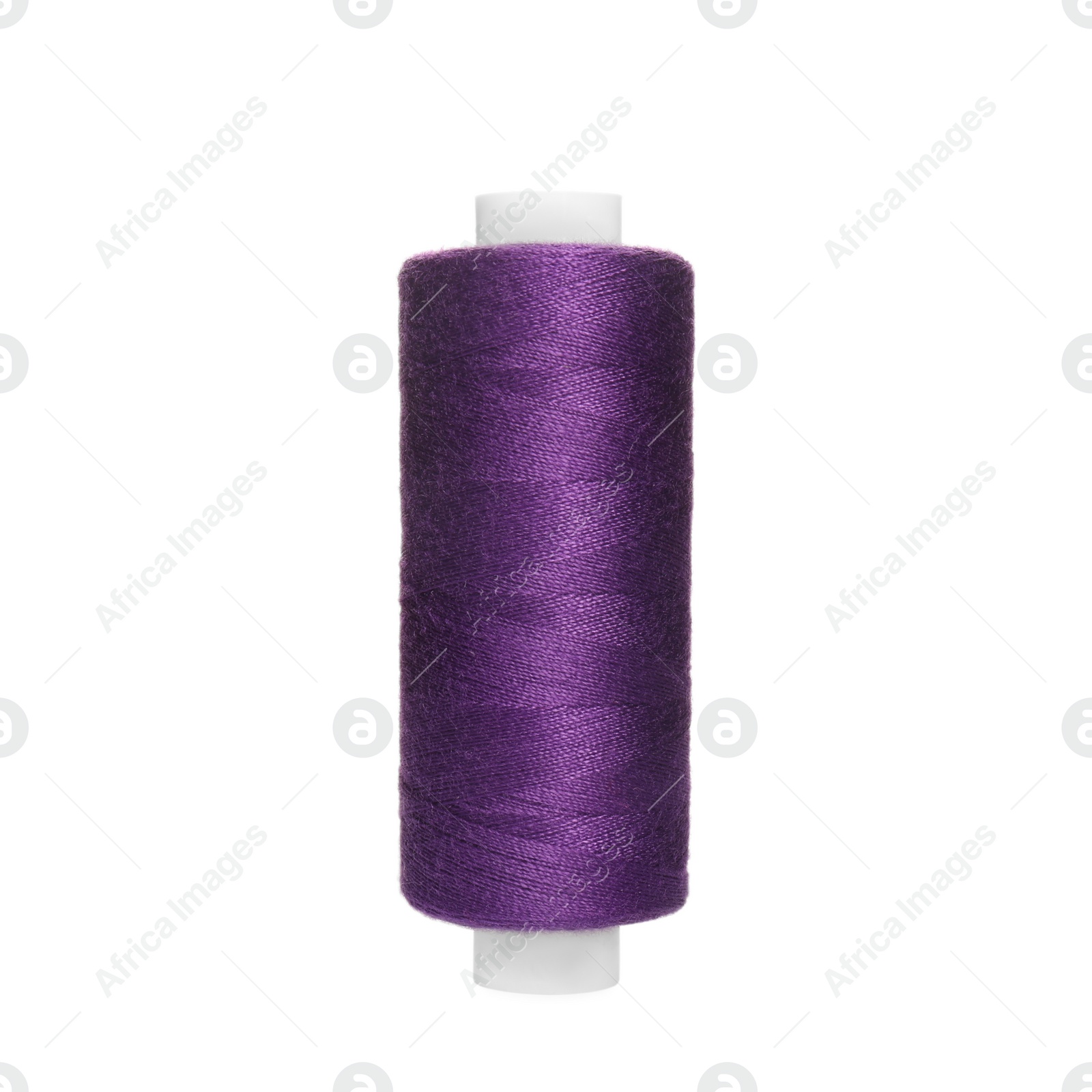 Photo of Spool of purple sewing thread isolated on white