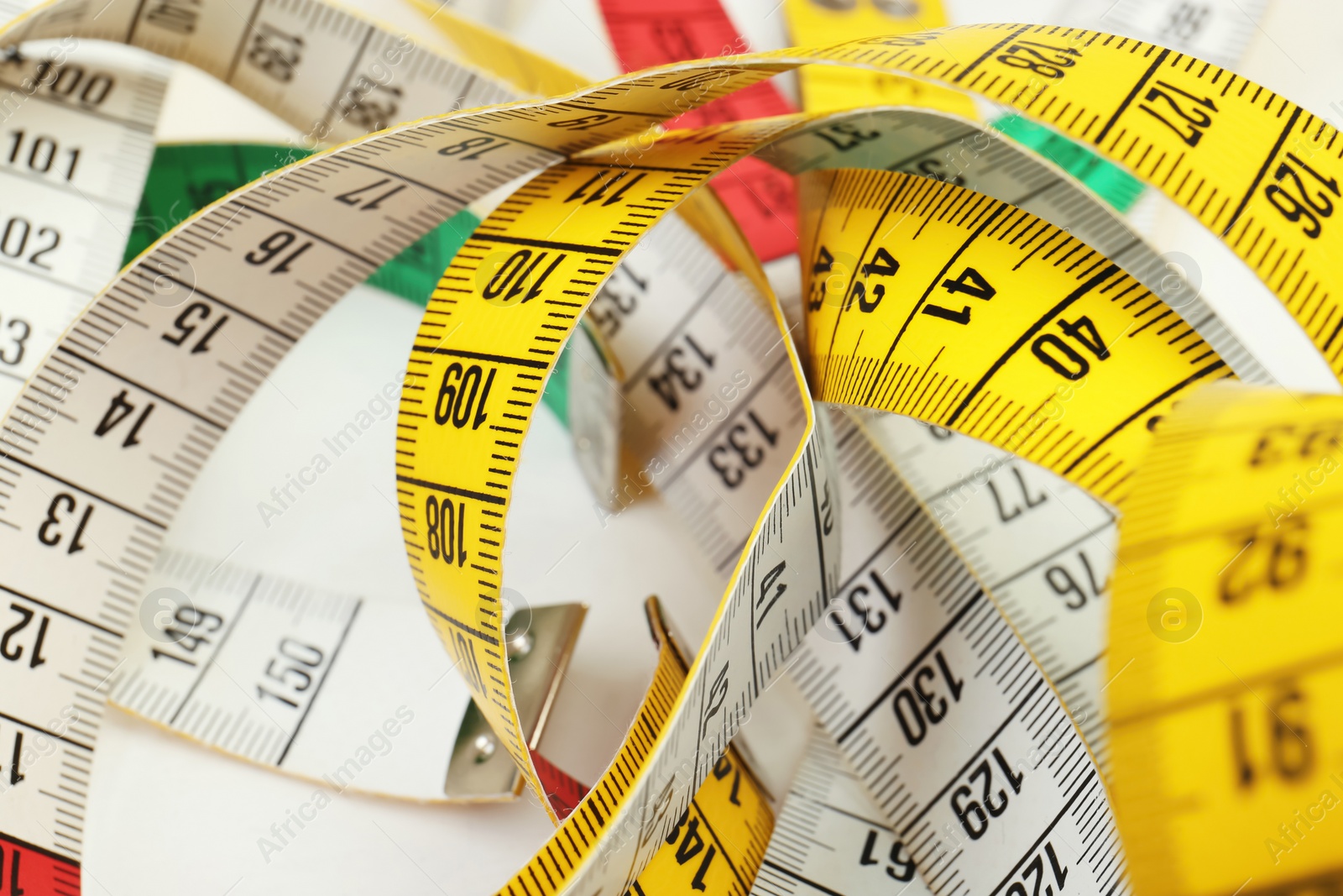 Photo of Different measuring tapes, closeup