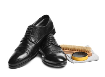 Photo of Stylish men's footwear and shoe care accessories on white background