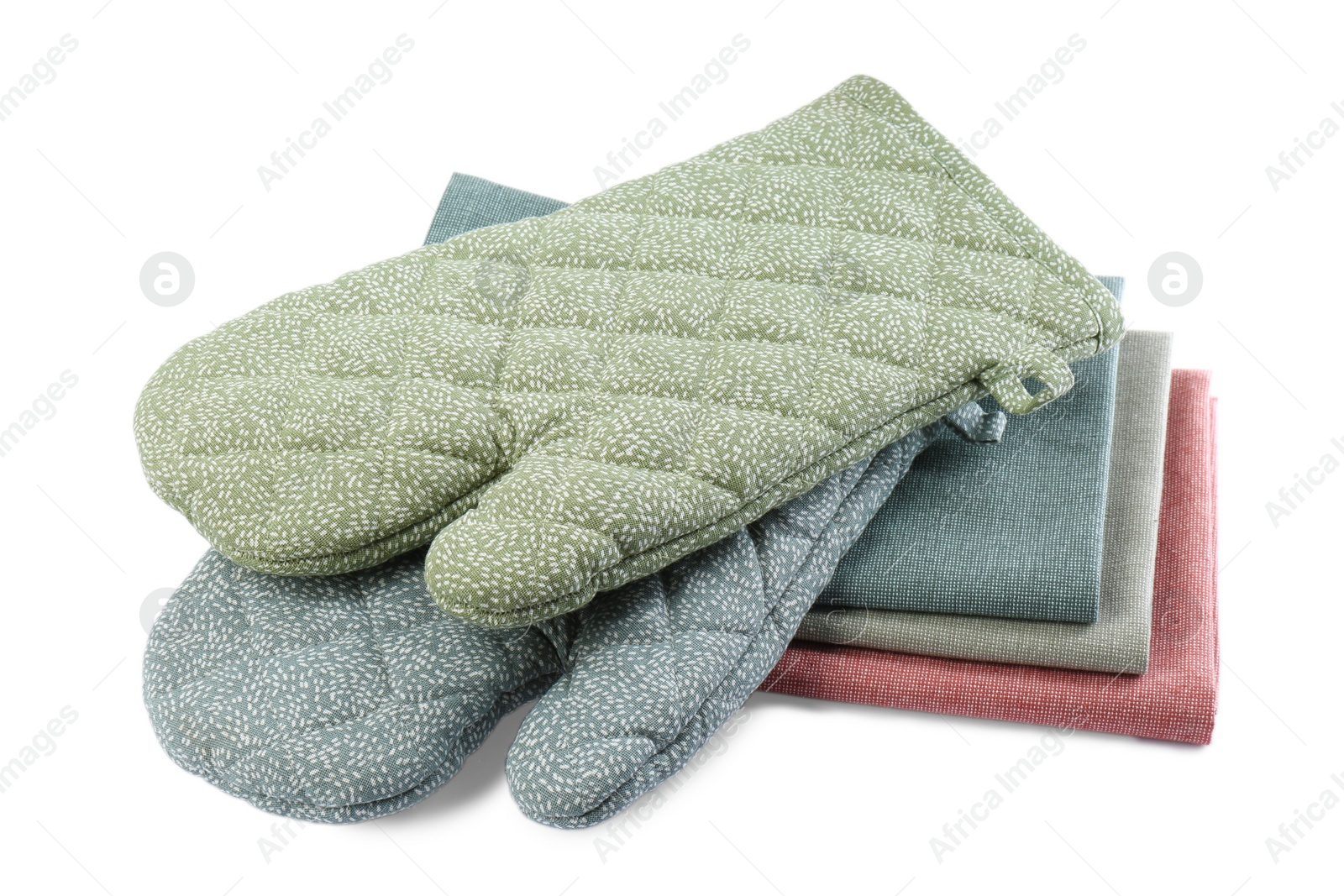 Photo of Kitchen towels and oven gloves for hot dishes on white background