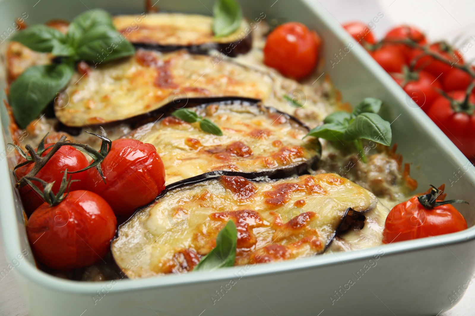 Photo of Delicious eggplant lasagna in baking dish, closeup