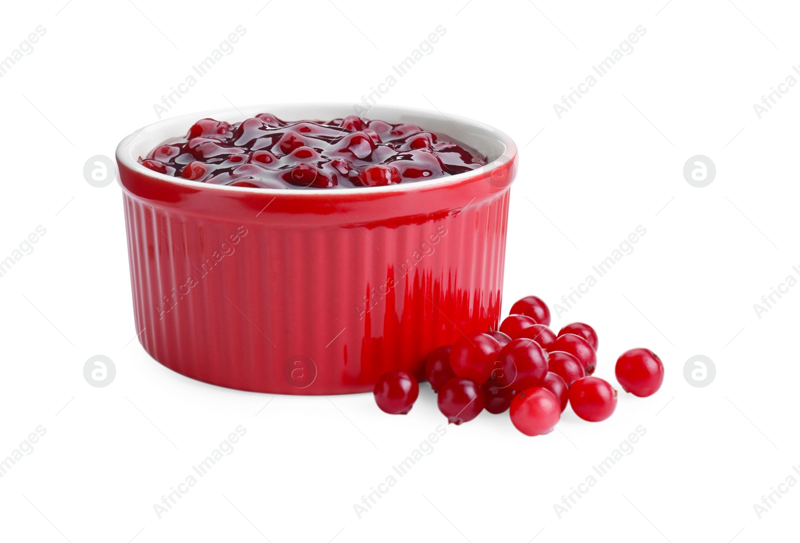 Photo of Cranberry sauce in bowl and fresh berries isolated on white