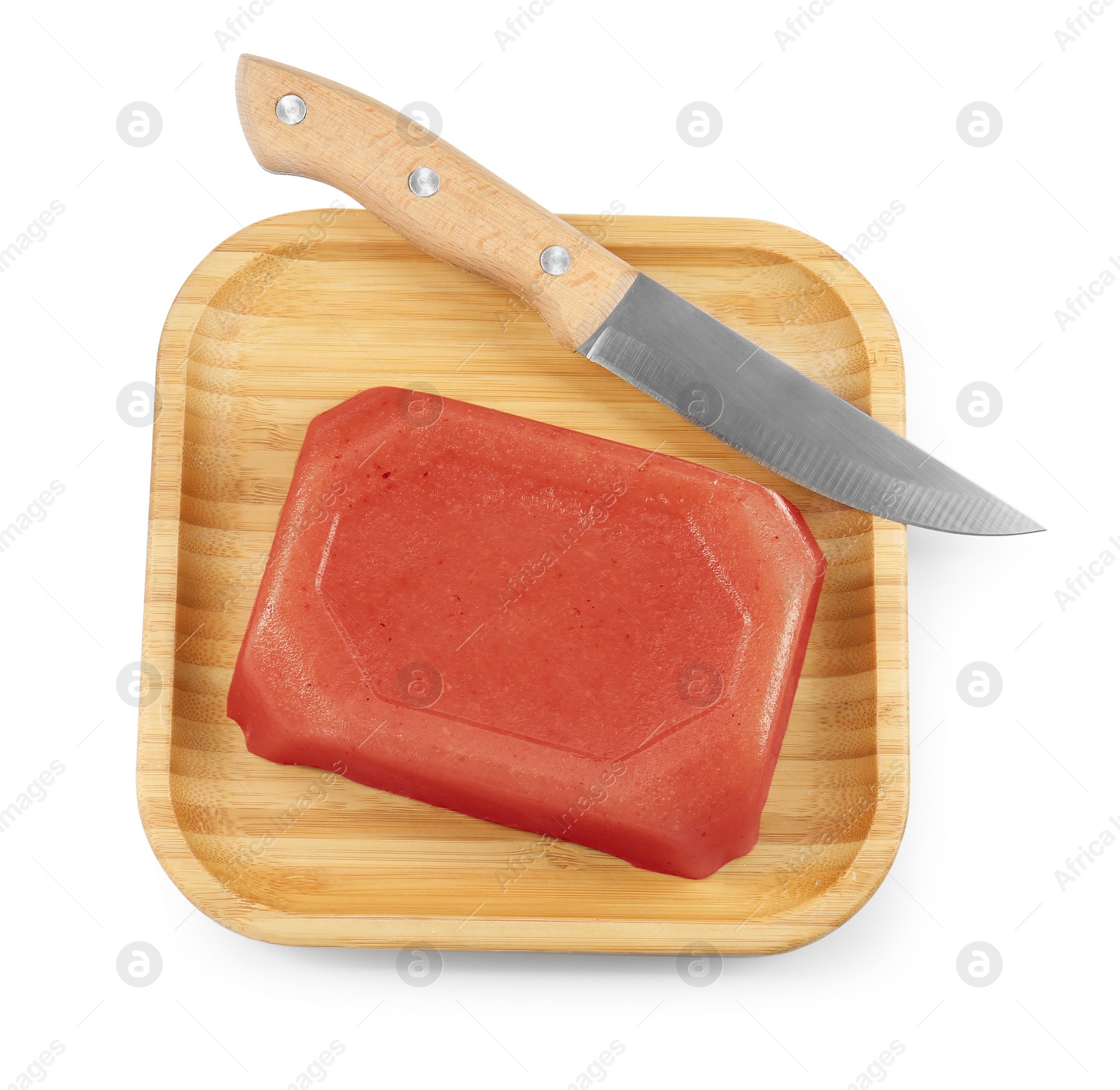 Photo of Delicious sweet quince paste and knife isolated on white, top view