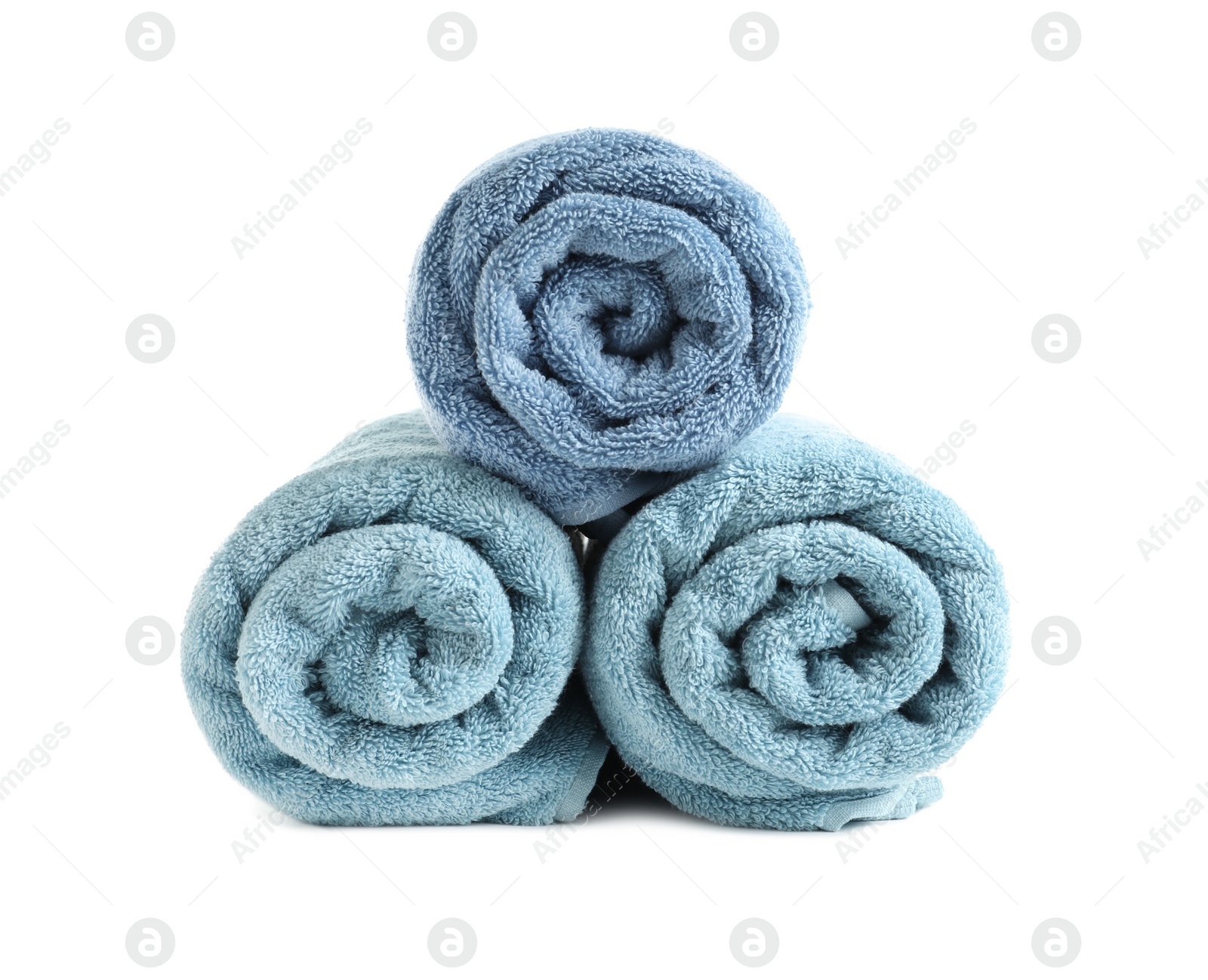 Photo of Rolled soft terry towels on white background