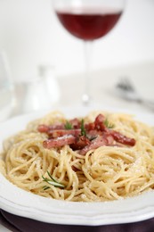 Photo of Delicious Carbonara pasta served on table, closeup