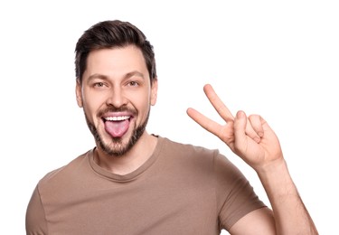 Photo of Happy man showing his tongue on white background