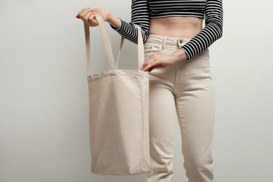 Photo of Woman with eco bag on white background, closeup