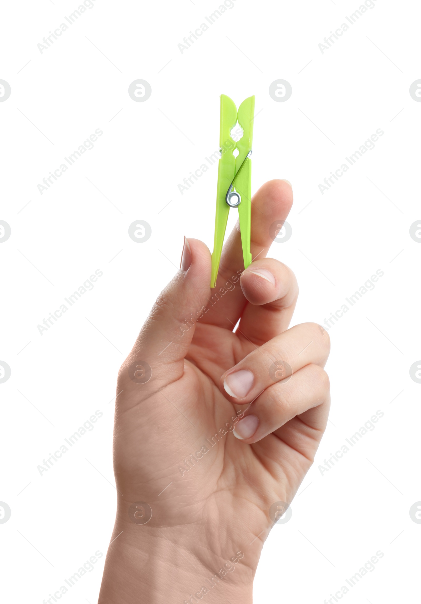 Photo of Woman holding bright green plastic clothespin on white background, closeup