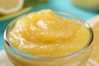 Photo of Delicious lemon curd in glass jar, closeup