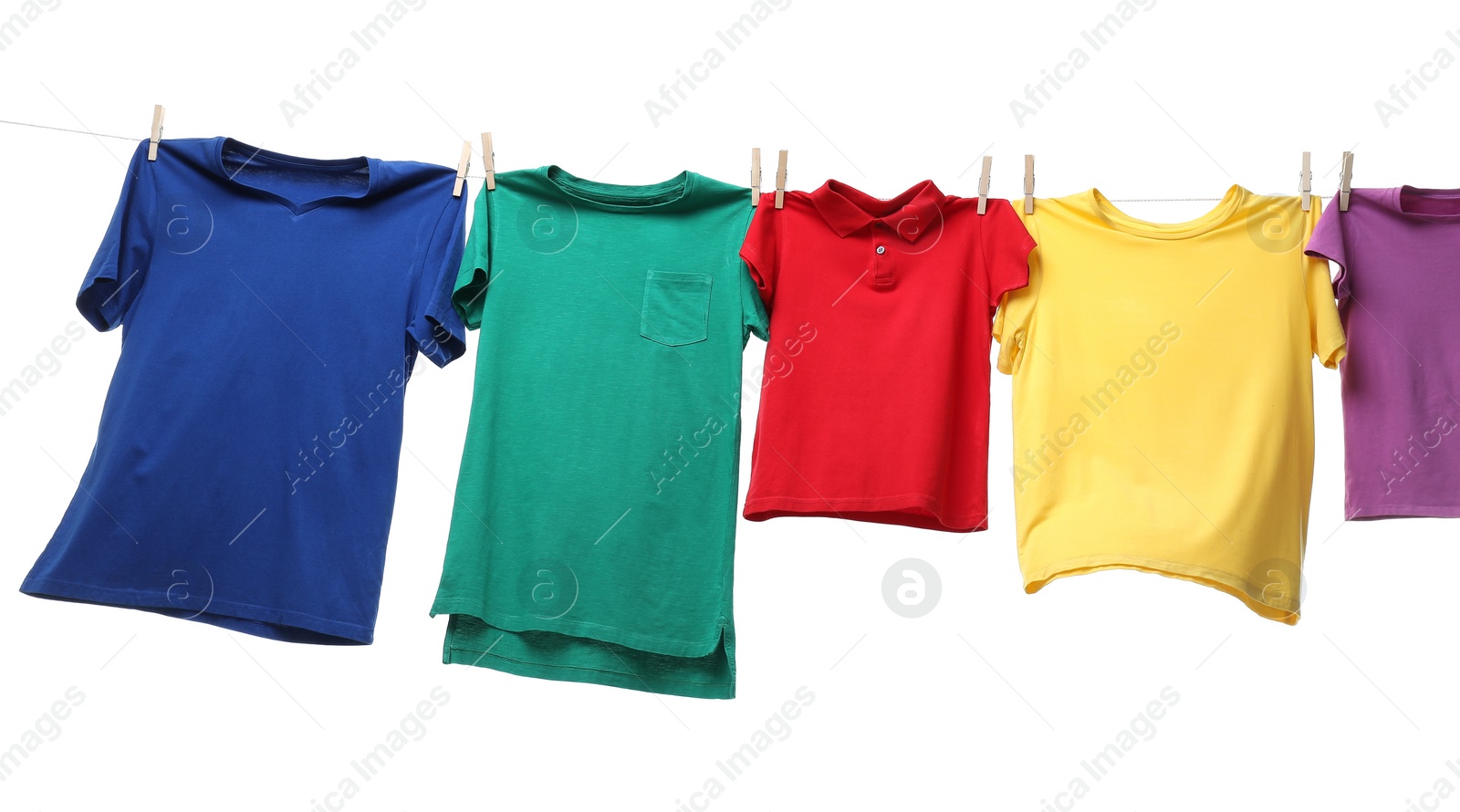 Photo of Colorful t-shirts drying on washing line isolated on white