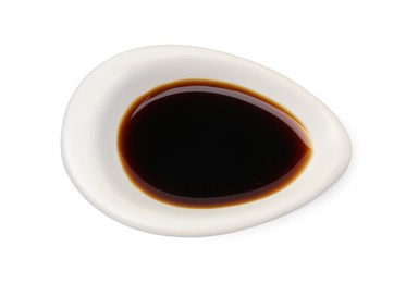 Photo of Tasty soy sauce in gravy boat isolated on white, top view