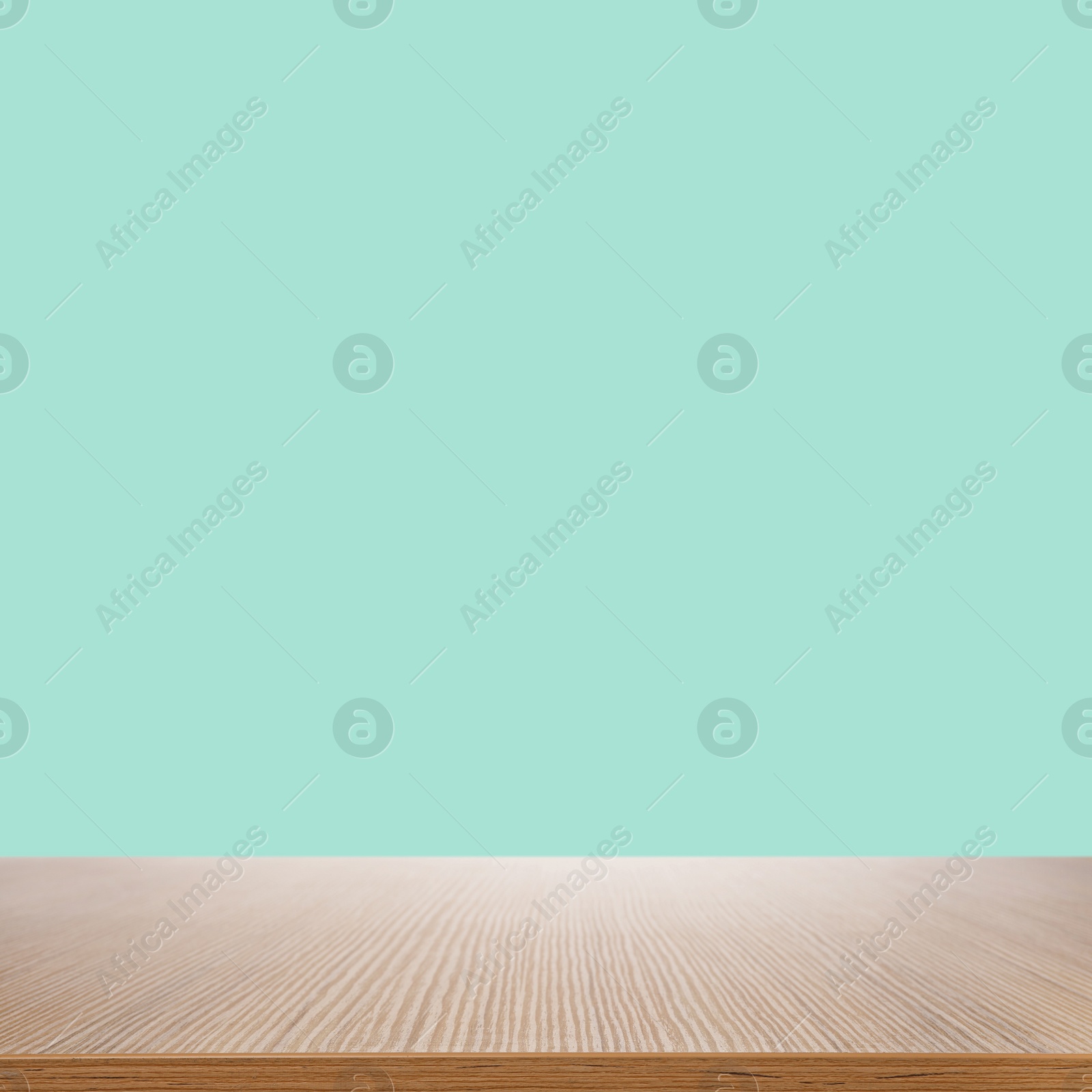 Image of Empty wooden surface on mint background. Mockup for design